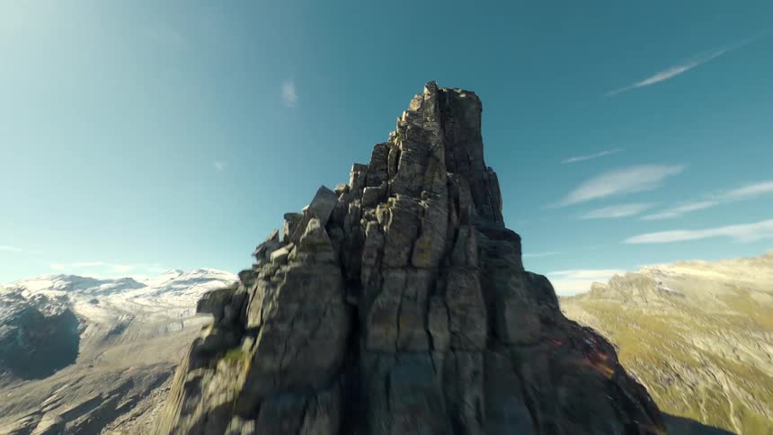 Aerial view of rocks and mountains with cliffs on a blue sky day