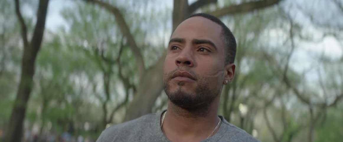 A man stands in a forest