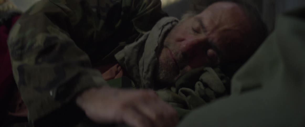 Homeless man laying down to sleep outside