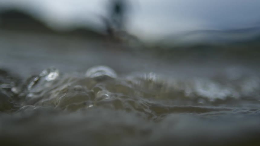 Water in a river bubbles and roils