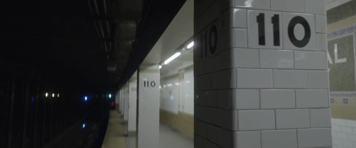 An empty subway station is visible