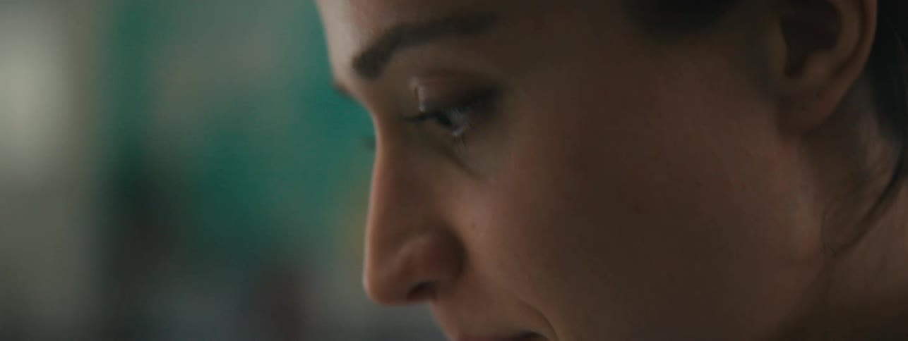 Woman smiles while focusing on her task