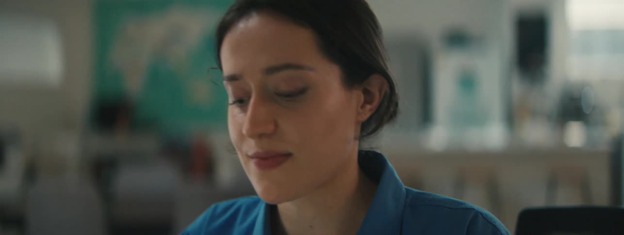 Portrait of a woman sitting in a room concentrating
