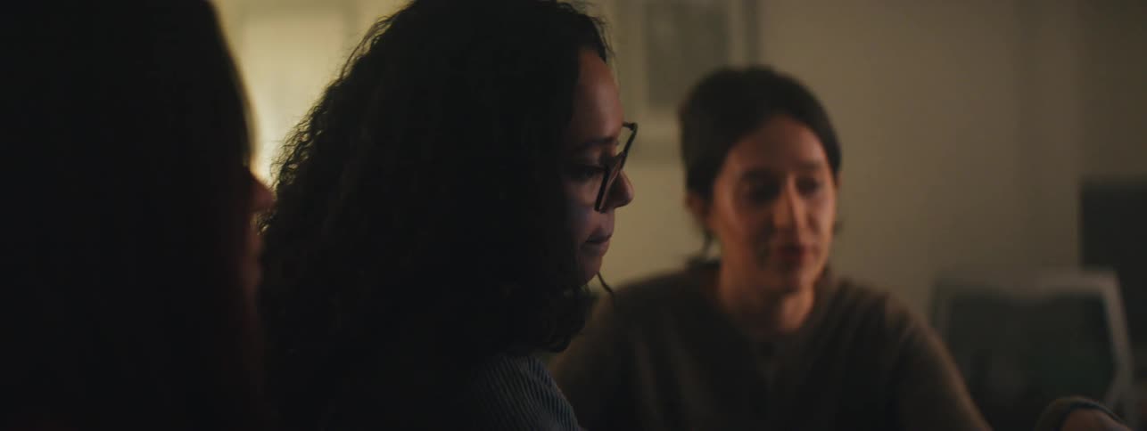 Portrait of three women sitting in a room talking