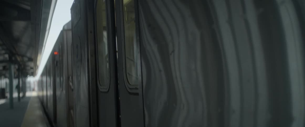 A commuter train's doors are closing
