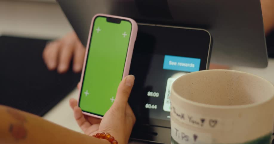 Hand making digital payment through smartphone