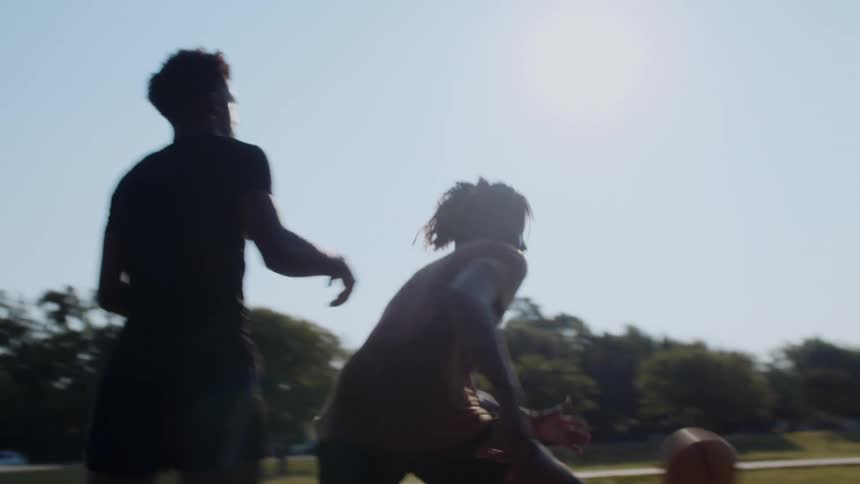 Two players compete in a basketball game