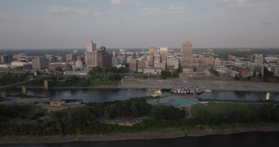 Aerial view of a waterfront city at evening