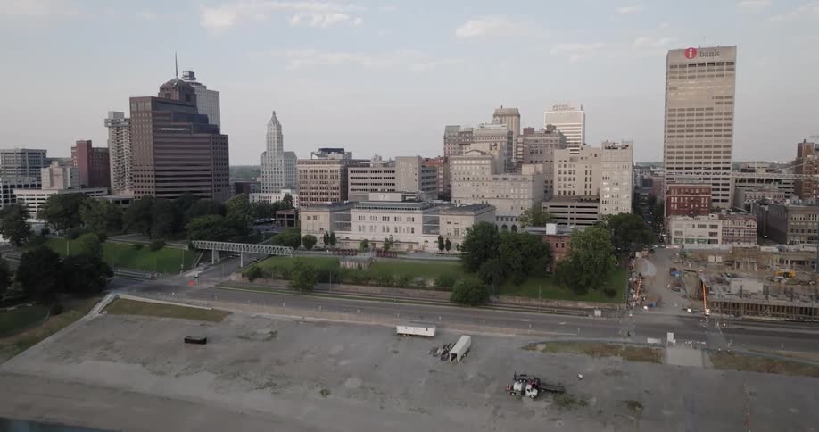 A panoramic view of memphis city skyline with a large sign with the name of the city