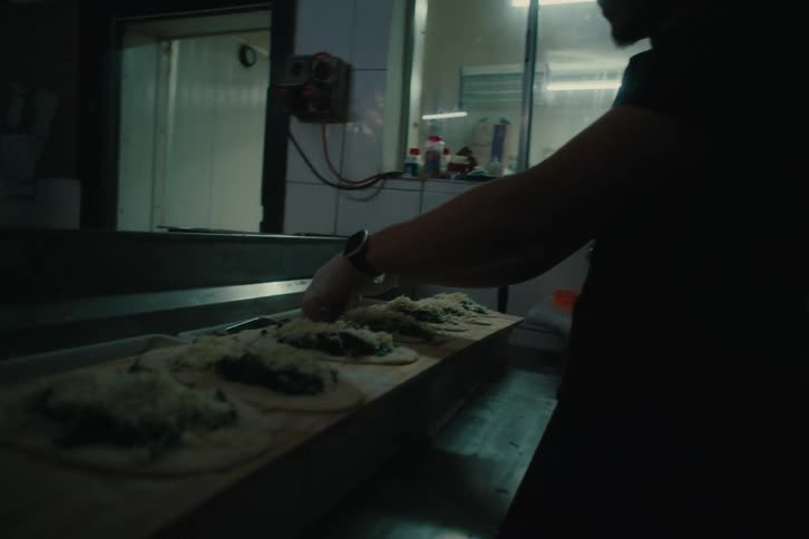 Man working inside a restaurant in a kitchen