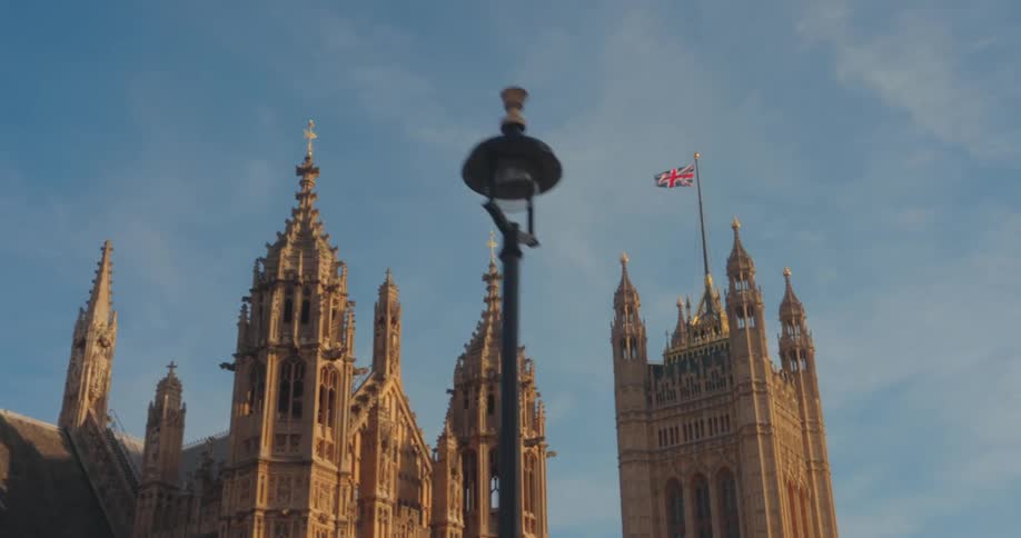 Cathedral with classic towers and the flag of the united kingdom on top