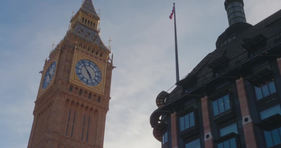 Big ben and part of the palace of westminster in london with a blue sky in the background