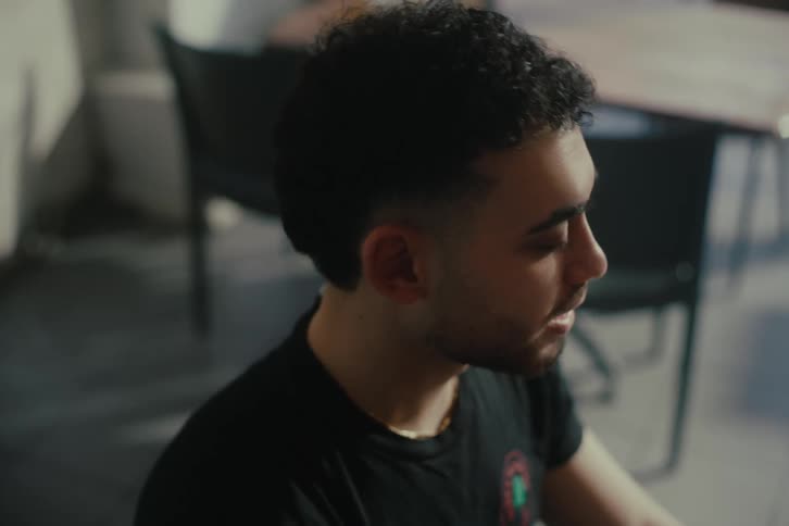 A man is smiling and talking