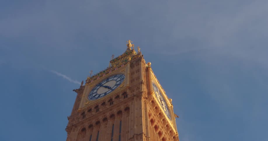 Low angle view of the elizabeth tower nicknamed as big ben under a blue sky