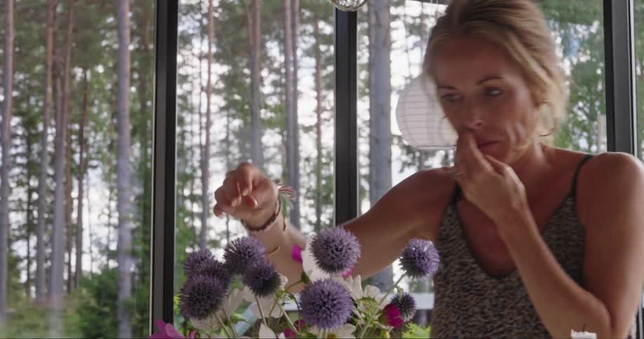 Woman assembling a flower arrangement
