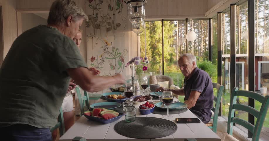 People are sitting down for a meal together