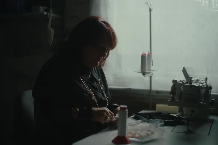 Woman working at a sewing table