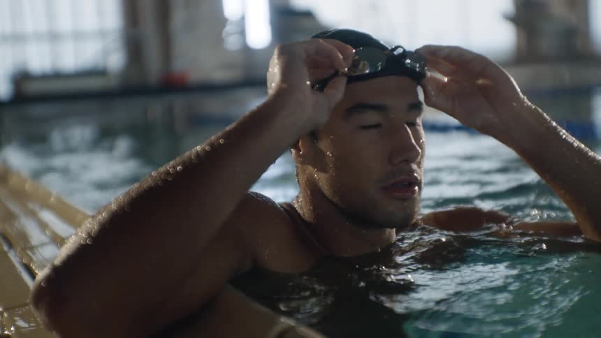 A man swims in the pool