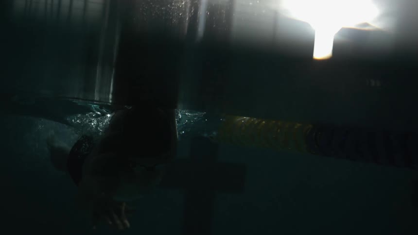 Person swimming in pool