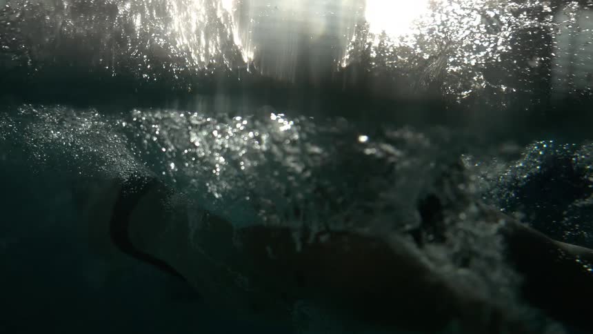 Person swimming in the pool