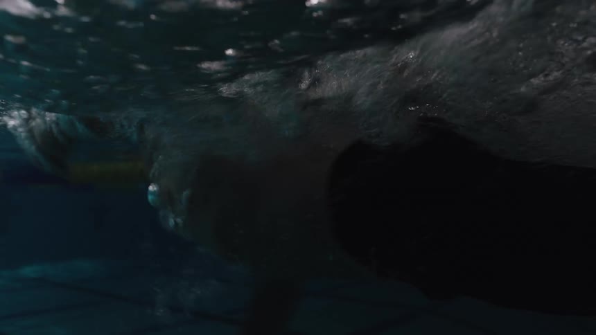 Swimmers swimming hard and fast in the pool