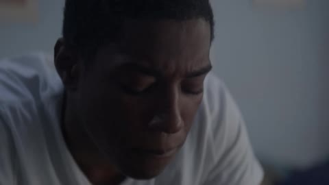 A man rubs his face and thinks