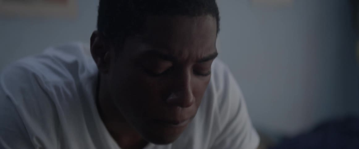 A man rubs his face and thinks