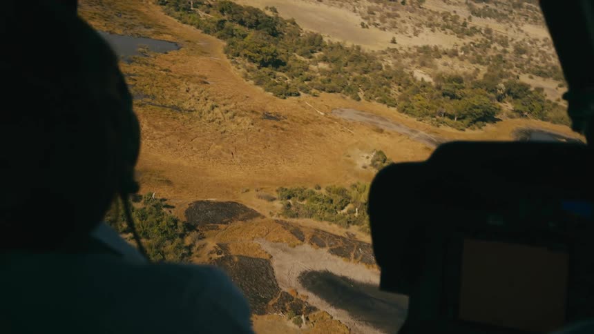 A person is flying a helicopter