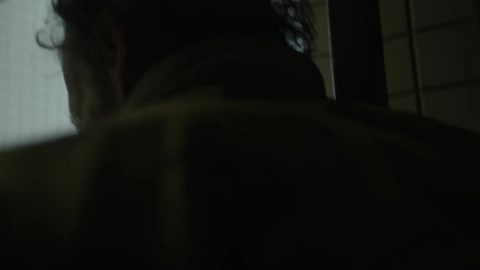 A man walks up a flight of stairs