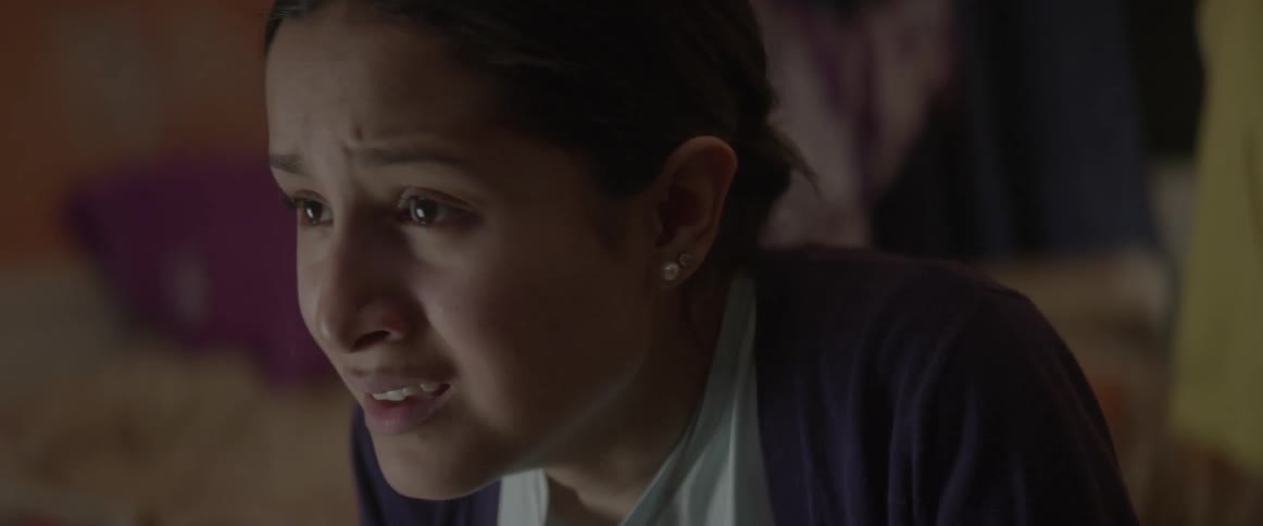 A young woman sobs
