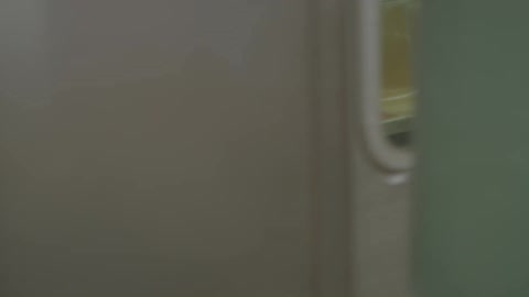 A subway car drives through a tunnel
