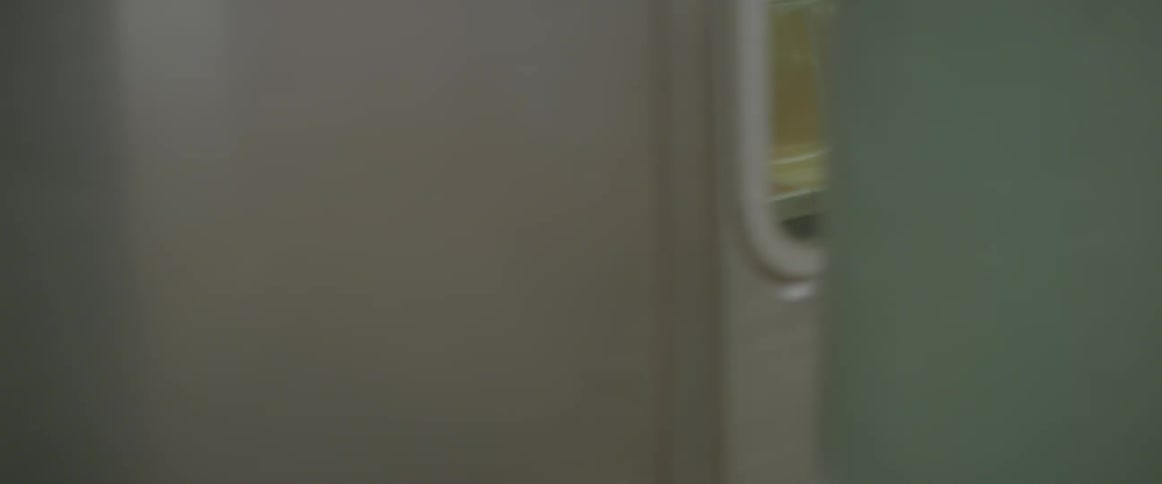 A subway car drives through a tunnel