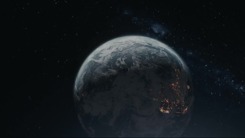 A depiction of earth with city lights visible from outer space