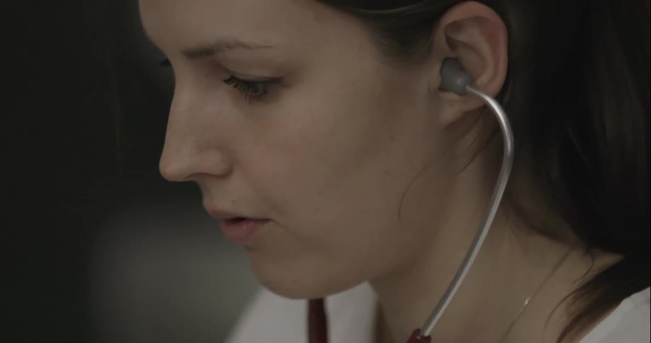 A doctor is wearing a stethoscope