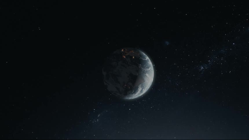 A depiction of planet earth orbiting the sun with city lights visible from space