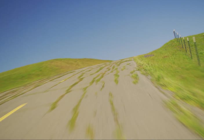 A winding road runs through the praire