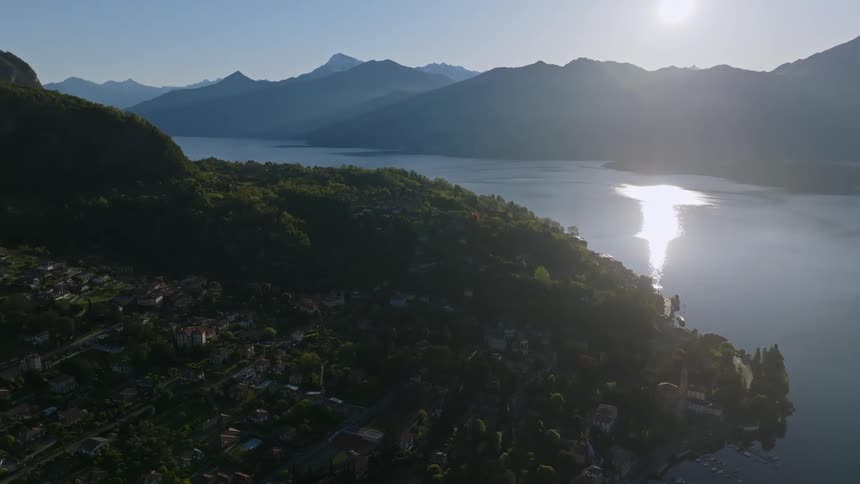 Aerial view of an urban city surrounded by mountains and the seaside