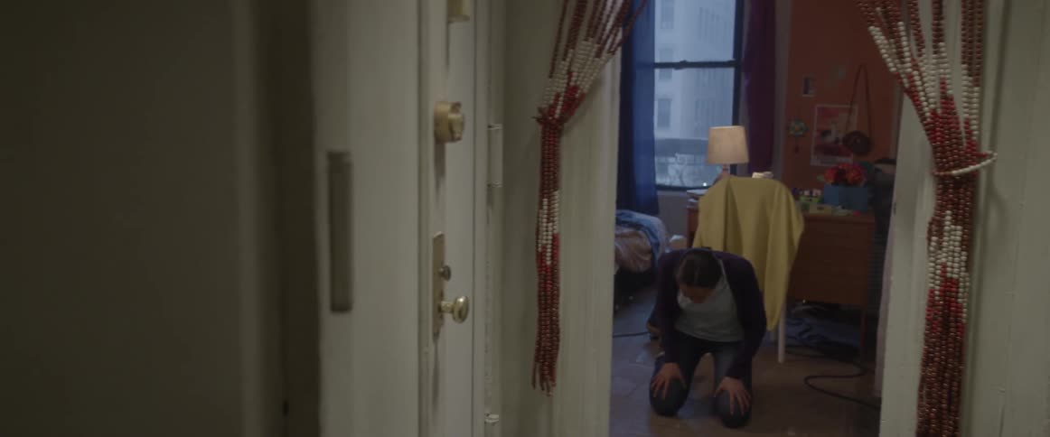 A woman drops to her knees down the hall sobbing