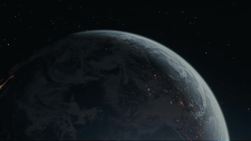The earth seen from space with half of it covered in shadow
