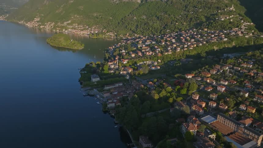 Aerial of a housing village set on a mountain lake on a summer day