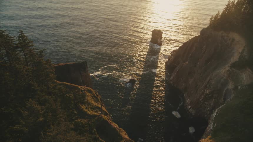 Aerial view of a steep slope with cliffs by the sea
