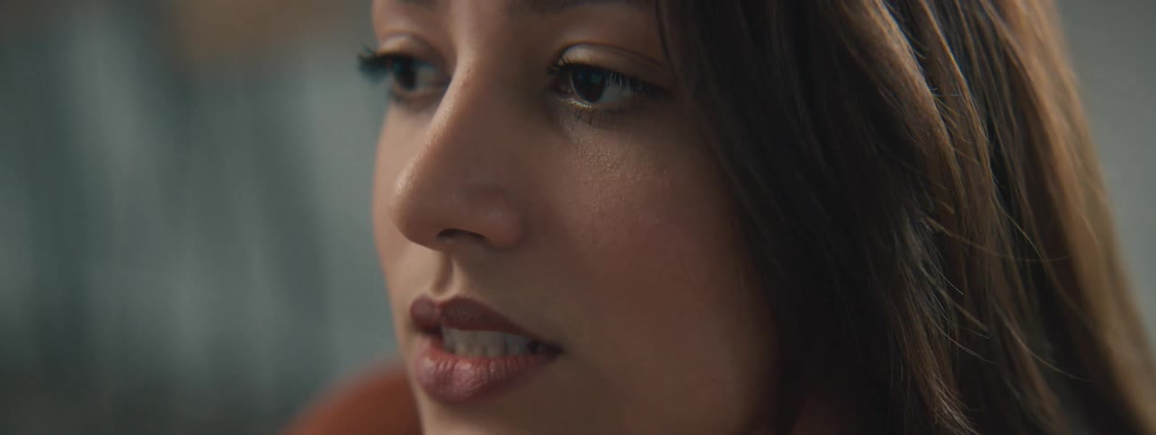 A woman is talking and nodding
