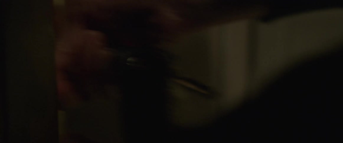 A person turns the key opening a door