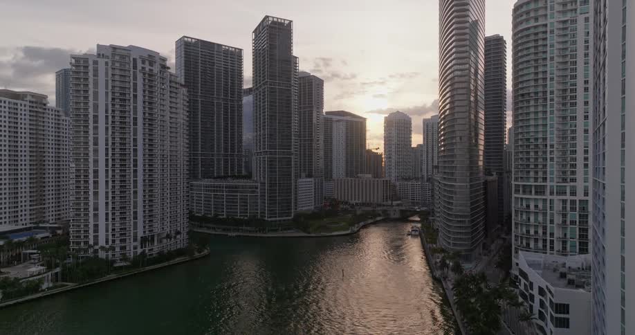 Water runs by the tall buildings
