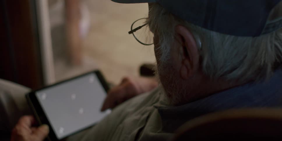 A man is using his tablet