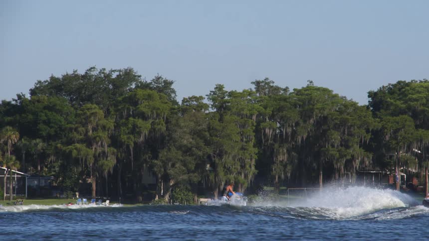 A water skier performs a jump