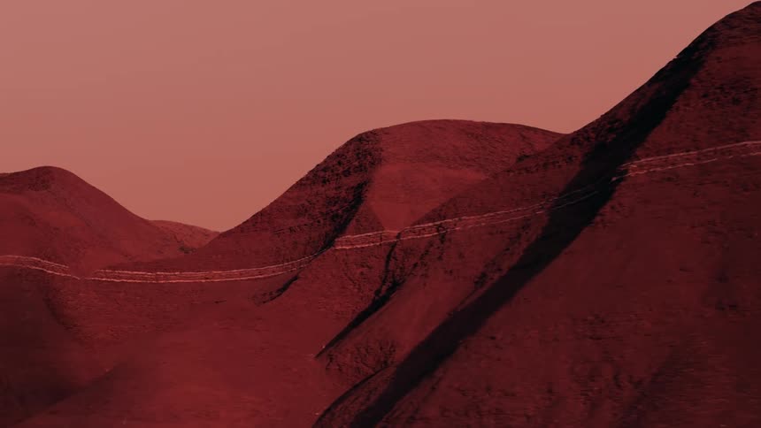 Reddish dunes in a cloudy sky