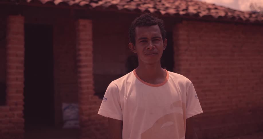 A man is standing outside a home