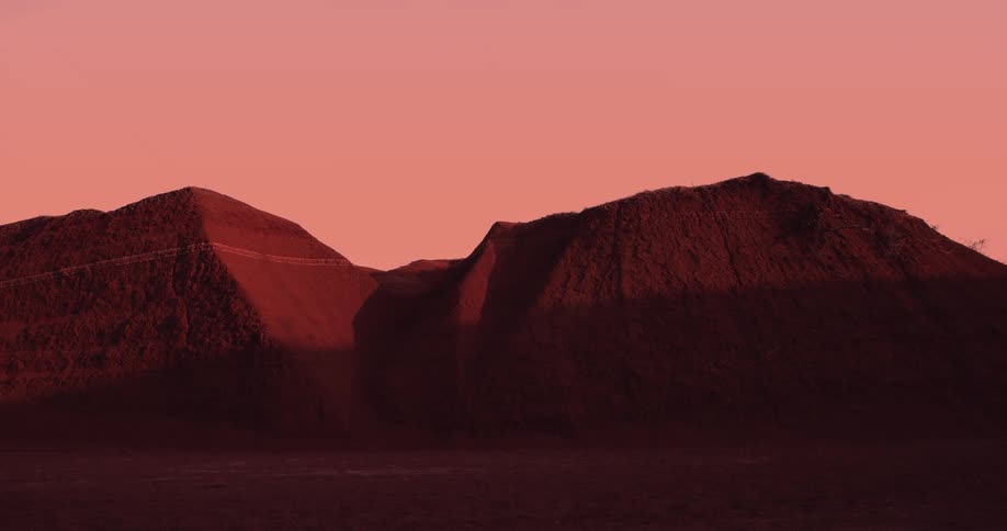 The sun is rising on the mountains