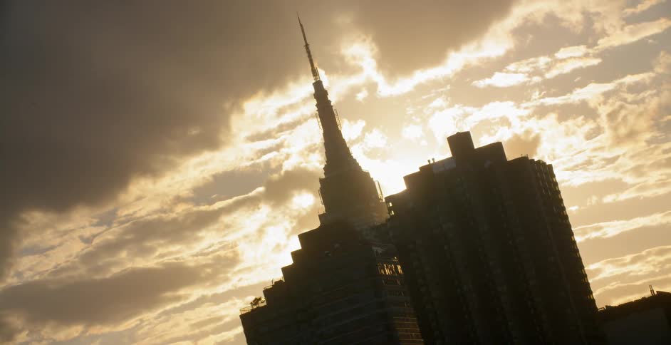 Three skyscrapers tower into the sky